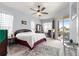 Bright bedroom boasts natural light, ceiling fan, and sliding glass doors to the lanai at 11799 Se 173Rd Lane Rd, Summerfield, FL 34491