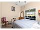 Cozy bedroom with neutral colors and a serene view at 11799 Se 173Rd Lane Rd, Summerfield, FL 34491