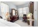 Bedroom with natural light showcasing a dresser and decorative furnishings at 11799 Se 173Rd Lane Rd, Summerfield, FL 34491