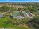 Aerial of the community center, boasting a pool, recreation facilities, and beautiful landscaping at 11799 Se 173Rd Lane Rd, Summerfield, FL 34491