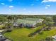 An aerial capture of the community center, highlighting its lush landscaping and verdant green spaces at 11799 Se 173Rd Lane Rd, Summerfield, FL 34491