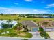 Attractive exterior view of a home with a well-kept lawn, paver driveway, and lovely landscaping at 11799 Se 173Rd Lane Rd, Summerfield, FL 34491