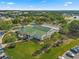 Stonecrest community clubhouse featuring well-manicured lawns and mature palm trees at 11799 Se 173Rd Lane Rd, Summerfield, FL 34491