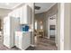 Bright hallway area with white cabinets, leading to additional rooms in the home at 11799 Se 173Rd Lane Rd, Summerfield, FL 34491