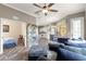 Spacious living room with an open floor plan and a large grey sectional couch at 11799 Se 173Rd Lane Rd, Summerfield, FL 34491