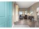 A well-lit living room showcases hardwood floors and views to the lanai at 11799 Se 173Rd Lane Rd, Summerfield, FL 34491