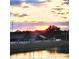 Picturesque sunset over the water, reflecting on the water's calm surface at 11799 Se 173Rd Lane Rd, Summerfield, FL 34491