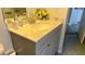 Bathroom vanity with light stone countertop and brushed nickel faucet at 14 Se 62Nd Ter, Ocala, FL 34471