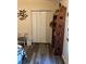 Bedroom with gray floors, closet, wood shelf, and chair at 14 Se 62Nd Ter, Ocala, FL 34471