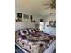 Bedroom featuring a large bed, white headboard, and neutral-toned walls at 14 Se 62Nd Ter, Ocala, FL 34471