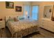 Bedroom with neutral walls, wood floors, and bright natural light at 14 Se 62Nd Ter, Ocala, FL 34471