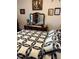 Bedroom featuring a decorative quilt, a dresser, and framed pictures on the wall at 14 Se 62Nd Ter, Ocala, FL 34471