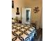 Bedroom with bed with colorful quilt and bathroom access at 14 Se 62Nd Ter, Ocala, FL 34471