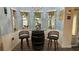 Cozy breakfast nook with blue walls, barrel table, and natural light at 14 Se 62Nd Ter, Ocala, FL 34471