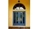 Stylish blue double front door with decorative glass and gold hardware at 14 Se 62Nd Ter, Ocala, FL 34471