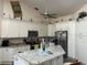 Bright kitchen featuring a large island, granite countertops, and stainless steel appliances at 14 Se 62Nd Ter, Ocala, FL 34471