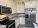 Modern kitchen boasts stainless steel appliances, stylish cabinets and stone countertops at 14 Se 62Nd Ter, Ocala, FL 34471
