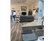 Open-concept living area with view of stylish, adjacent kitchen at 14 Se 62Nd Ter, Ocala, FL 34471