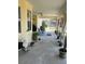 A screened porch with seating. The space is large with seating and decor, making a comfortable place to relax at 14 Se 62Nd Ter, Ocala, FL 34471