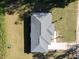 Aerial view of a home highlighting the roof, well-manicured lawn, and a convenient driveway at 14471 Sw 76Th Avenue Rd, Ocala, FL 34473