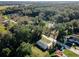 Scenic aerial view of a home surrounded by trees, showcasing the property's spacious yard and serene neighborhood at 14471 Sw 76Th Avenue Rd, Ocala, FL 34473