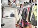 Organized walk-in closet with shelving, hanging racks, and ample storage for clothes and accessories at 14471 Sw 76Th Avenue Rd, Ocala, FL 34473