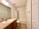 Bathroom featuring a single sink vanity, toilet, and shower/tub combo with a curtain at 15782 Sw 16Th Avenue Rd, Ocala, FL 34473