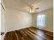 Bedroom featuring hardwood floors, ceiling fan, and natural light from the window at 15782 Sw 16Th Avenue Rd, Ocala, FL 34473