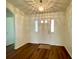 Well-lit foyer featuring hardwood floors and a decorative light fixture at 15782 Sw 16Th Avenue Rd, Ocala, FL 34473