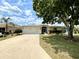 Well-maintained single Gathering home featuring a lush green lawn and mature landscaping at 15782 Sw 16Th Avenue Rd, Ocala, FL 34473