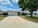 Well-maintained single Gathering home featuring a lush green lawn and mature landscaping at 15782 Sw 16Th Avenue Rd, Ocala, FL 34473