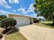 Charming single-story home with a well manicured lawn and two car garage at 15782 Sw 16Th Avenue Rd, Ocala, FL 34473