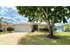 Well-maintained single Gathering home featuring a lush green lawn and mature landscaping at 15782 Sw 16Th Avenue Rd, Ocala, FL 34473