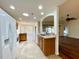 Well-lit eat-in kitchen featuring tile flooring and white appliances with an open layout at 15782 Sw 16Th Avenue Rd, Ocala, FL 34473