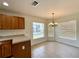 Bright breakfast nook with tan tile and light wood cabinets with lots of natural light at 15782 Sw 16Th Avenue Rd, Ocala, FL 34473