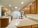 Spacious kitchen features light wood cabinetry, white appliances and plenty of counter space at 15782 Sw 16Th Avenue Rd, Ocala, FL 34473