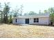 The home has a cozy back patio and the large, flat yard is perfect for pets, play, or relaxing at 20 Malauka Pass Crse, Ocklawaha, FL 32179