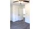 Bedroom with new flooring, showcasing access to the walk-in closet at 20 Malauka Pass Crse, Ocklawaha, FL 32179