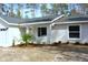 A charming one story home featuring a low maintenance yard with tasteful plantings and an attached garage at 20 Malauka Pass Crse, Ocklawaha, FL 32179