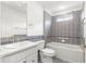 Updated bathroom featuring tiled walls, shower-over-tub, and modern fixtures at 2087 Bonneau Ln, The Villages, FL 32162