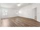Bedroom featuring wood-look floors, and natural light from the windows at 2087 Bonneau Ln, The Villages, FL 32162