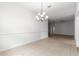 Bright and airy dining room featuring tile floors, chandelier, and ample room for entertaining guests at 2087 Bonneau Ln, The Villages, FL 32162