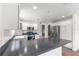 Bright kitchen featuring white cabinets, stainless steel appliances, and a peninsula with bar seating at 2087 Bonneau Ln, The Villages, FL 32162