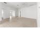 A bright and spacious living room with neutral tile flooring and large windows, offering ample natural light at 2087 Bonneau Ln, The Villages, FL 32162