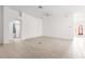 Bright living room with neutral tile flooring and a ceiling fan at 2087 Bonneau Ln, The Villages, FL 32162