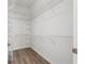 Bright walk-in closet providing ample storage with wire shelving at 2087 Bonneau Ln, The Villages, FL 32162
