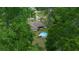 Aerial view of a home featuring an above ground pool and screened in porch at 21168 Sw Peach Blossom St, Dunnellon, FL 34431