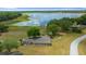 Aerial view of the lakefront with playground and gathering place providing a perfect community area at 21168 Sw Peach Blossom St, Dunnellon, FL 34431