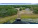 Stunning aerial of the lake and community amenities, including a dock for all water sport enthusiasts at 21168 Sw Peach Blossom St, Dunnellon, FL 34431