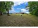 Large, private backyard with mature trees and plenty of space to relax and entertain at 21168 Sw Peach Blossom St, Dunnellon, FL 34431